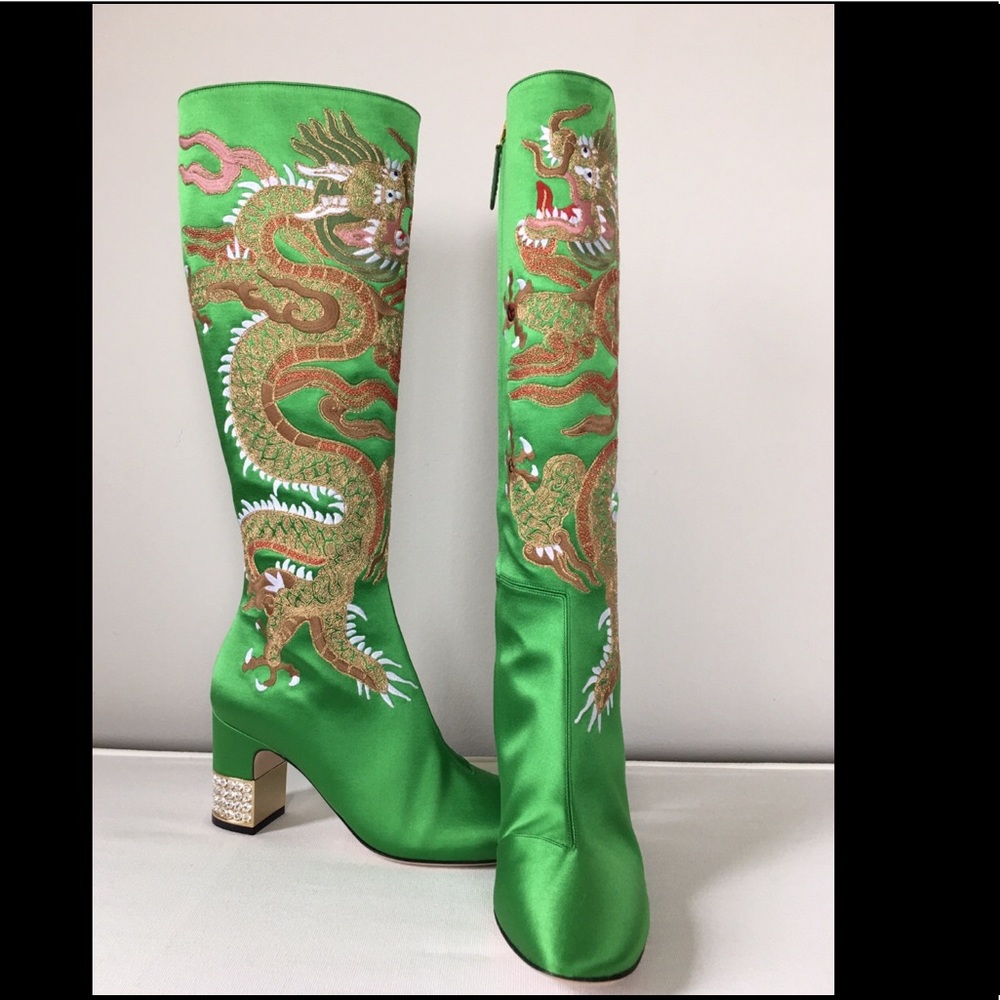 Gucci satin boots with embroidered dragons.